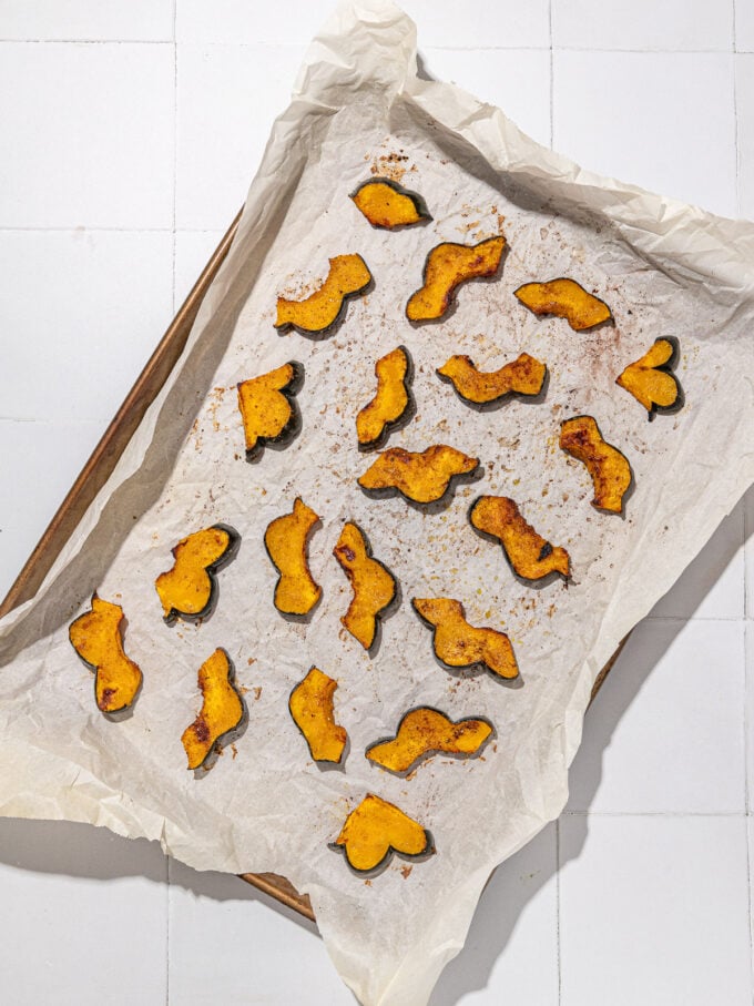 roasted acorn squash on baking sheet