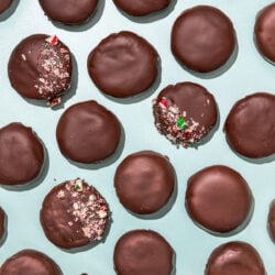 chocolate covered cookies with sprinkles of candy cane